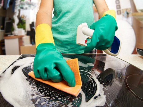 Cleaning staff handling waste and protective materials safely
